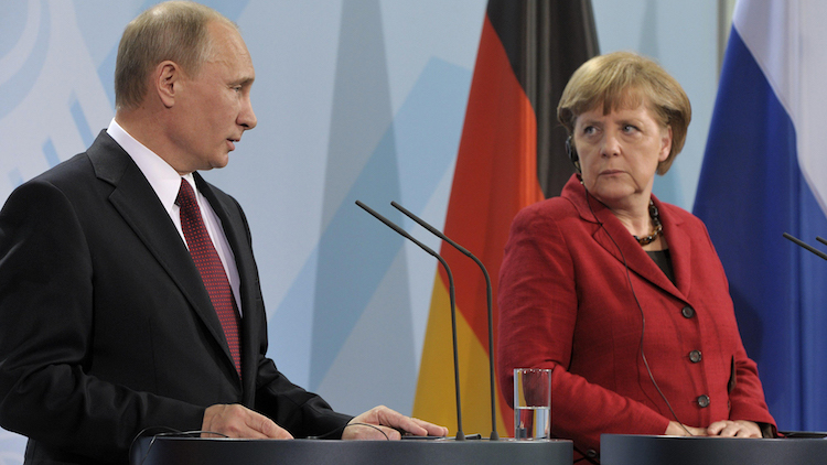 German Chancellor Angela Merkel looking warily at Russian President Vladimir Putin.