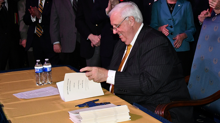 Jim Justice signing a bill