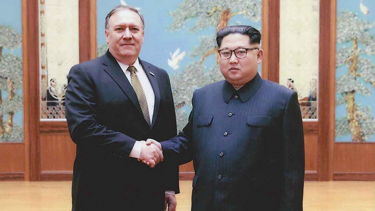 Kim Jong Un and Mike Pompeo