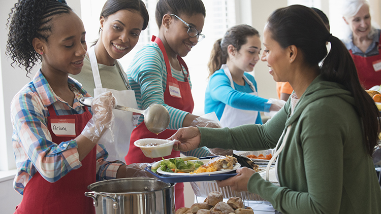 People helping at a soup kitchen