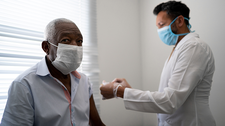 patient getting vaccination using face mask