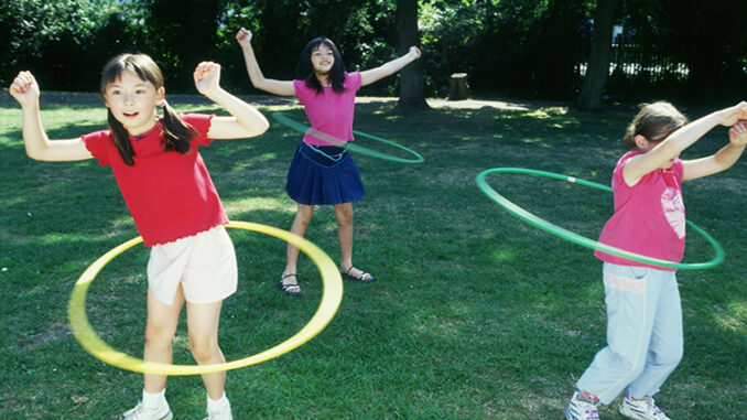 IS_K-1_NEWS_JUN_2025_004P Children spinning a toy hoop around their waists