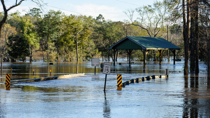 Heavy rains flooded the Choctawhatchee River in Ebro, Florida resulting in this bridge and road being under water.
