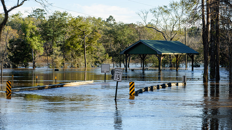Heavy rains flooded the Choctawhatchee River in Ebro, Florida resulting in this bridge and road being under water.
